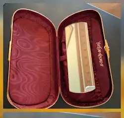YVES SAINT LAURENT Minaudière dorée YSL années 80